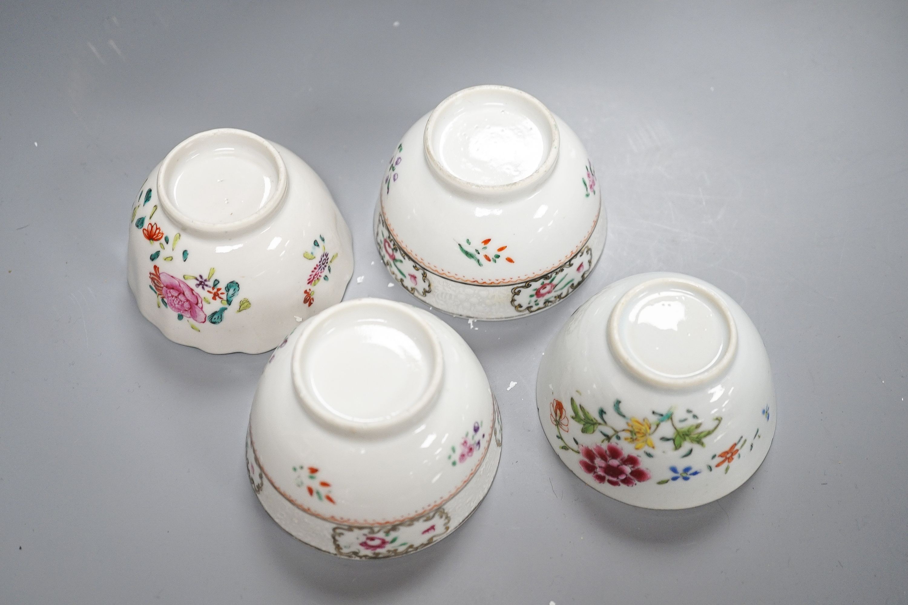 A 19th century Chinese blue and white Prunus jar and cover, 36cm and a group of 18th century Chinese export famille rose tea bowls and a plate